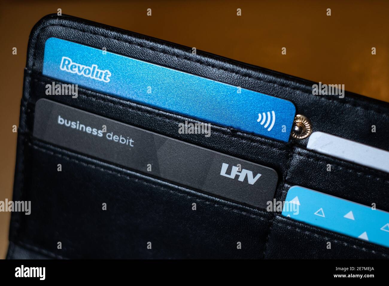 Revolut and LHV business bank cards in black wallet. Revolut is UK based global fin tech company. LHV is Estonian banking and financial company Stock Photo