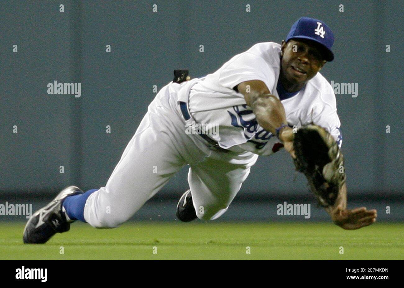 Los Angeles Dodgers center fielder Juan Pierre dives and catches a ball hit  by Colorado Rockies Matt Holliday during the first inning of an MLB  National League baseball game in Los Angeles,