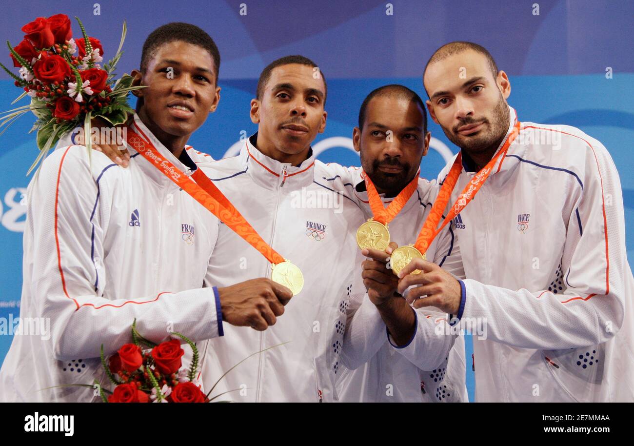 L-R) Ulrich Robeiri, Jean-Michel Lucenay, Jerome Jeannet and brother  Fabrice Jeannet of France pose after winning gold in the men's team epee  fencing competition at the Beijing 2008 Olympic Games, August 14,