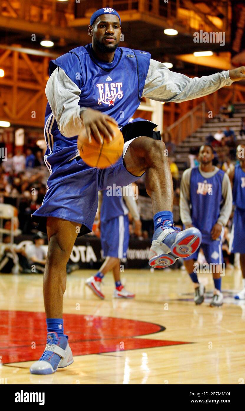LeBron James of the Cleveland Cavaliers dribbles between his legs during  practice for the National Basketball Association All-Star game in New  Orleans, Louisiana February 16, 2008. REUTERS/Jeff Haynes (UNITED STATES  Stock Photo -
