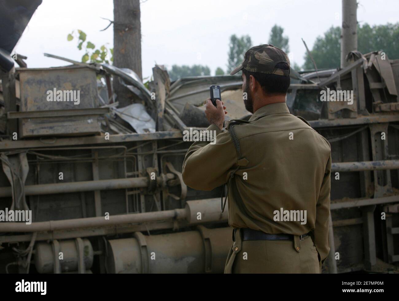 An Indian policeman uses his mobile 