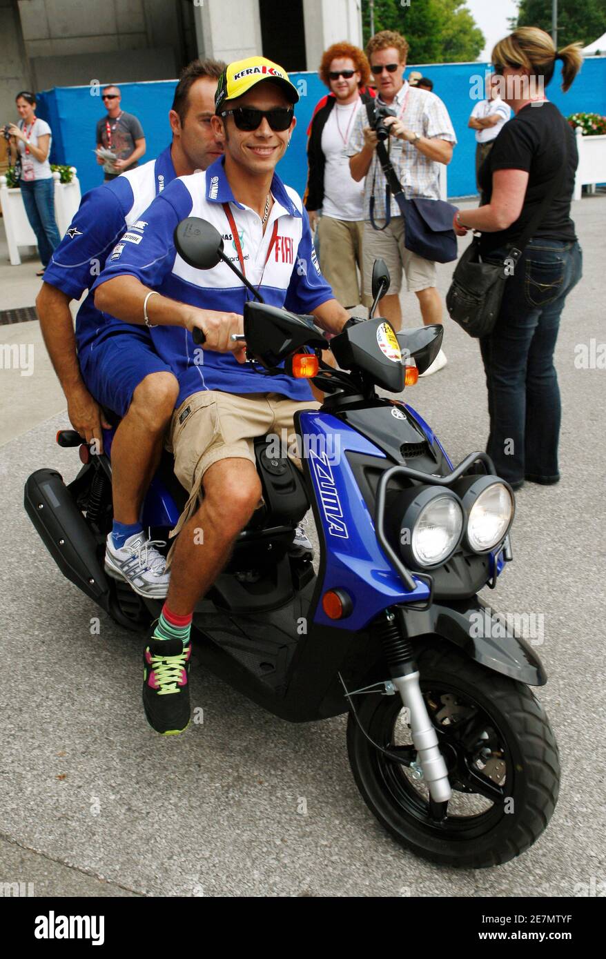 Yamaha MotoGP rider Valentino Rossi of Italy drives a scooter away from his  garage area before Indianapolis Grand Prix practice at the Indianapolis  Motor Speedway in Indianapolis August 28, 2009. REUTERS/Brent Smith (