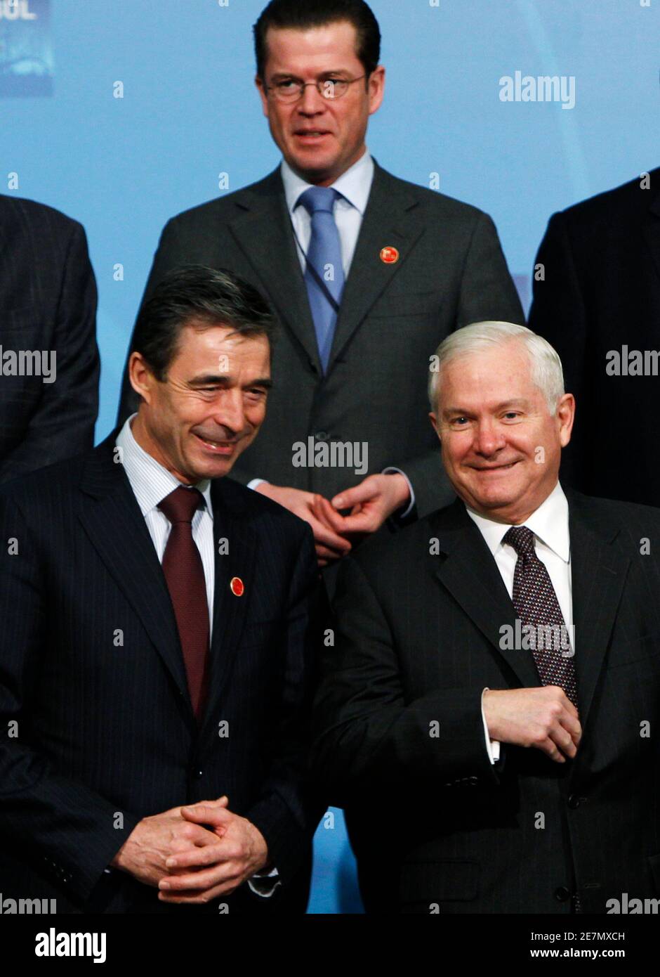 NATO Secretary-General Anders Fogh Rasmussen (L) poses with U.S. Defence Secretary Robert Gates (R) and Germany's Defence Minister Karl-Theodor zu Guttenberg (back C) for a group photo during the informal meeting of NATO Defence Ministers in Istanbul February 5, 2010.  REUTERS/Murad Sezer (TURKEY - Tags: POLITICS) Stock Photo
