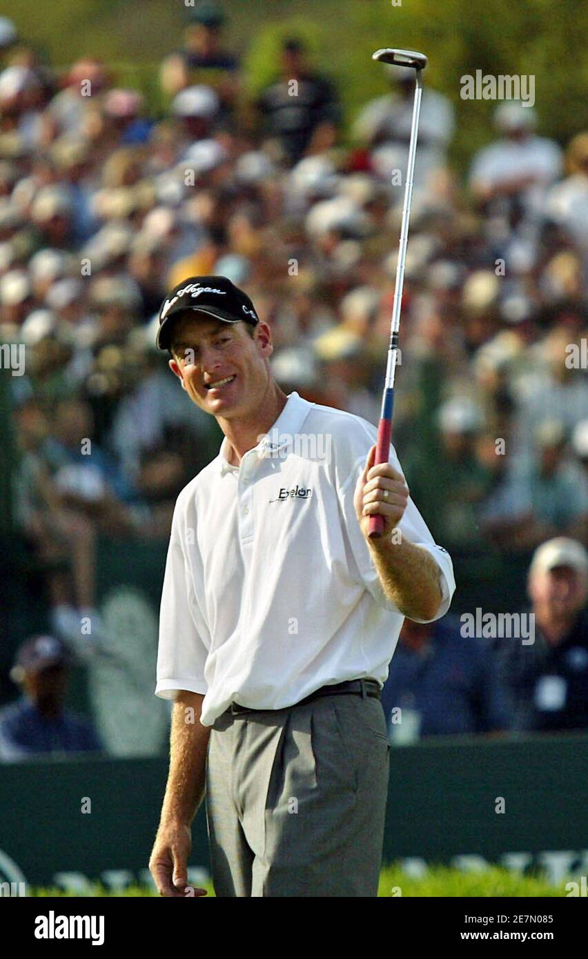 Jim Furyk of the U.S. smiles at the 18th hole during the Sun City Golf Challenge in Sun City, west of Johannesburg, in South Africa December 4, 2005. Furyk chipped in on the second extra hole of a sudden-death playoff to win the 25th Sun City Golf Challenge on Sunday. Furyk's birdie from 15-feet from the back of the par-four 18th green beat off Briton Darren Clarke and Australia's Adam Scott for the $1.2 million first prize. REUTERS/Juda Ngwenya Stock Photo