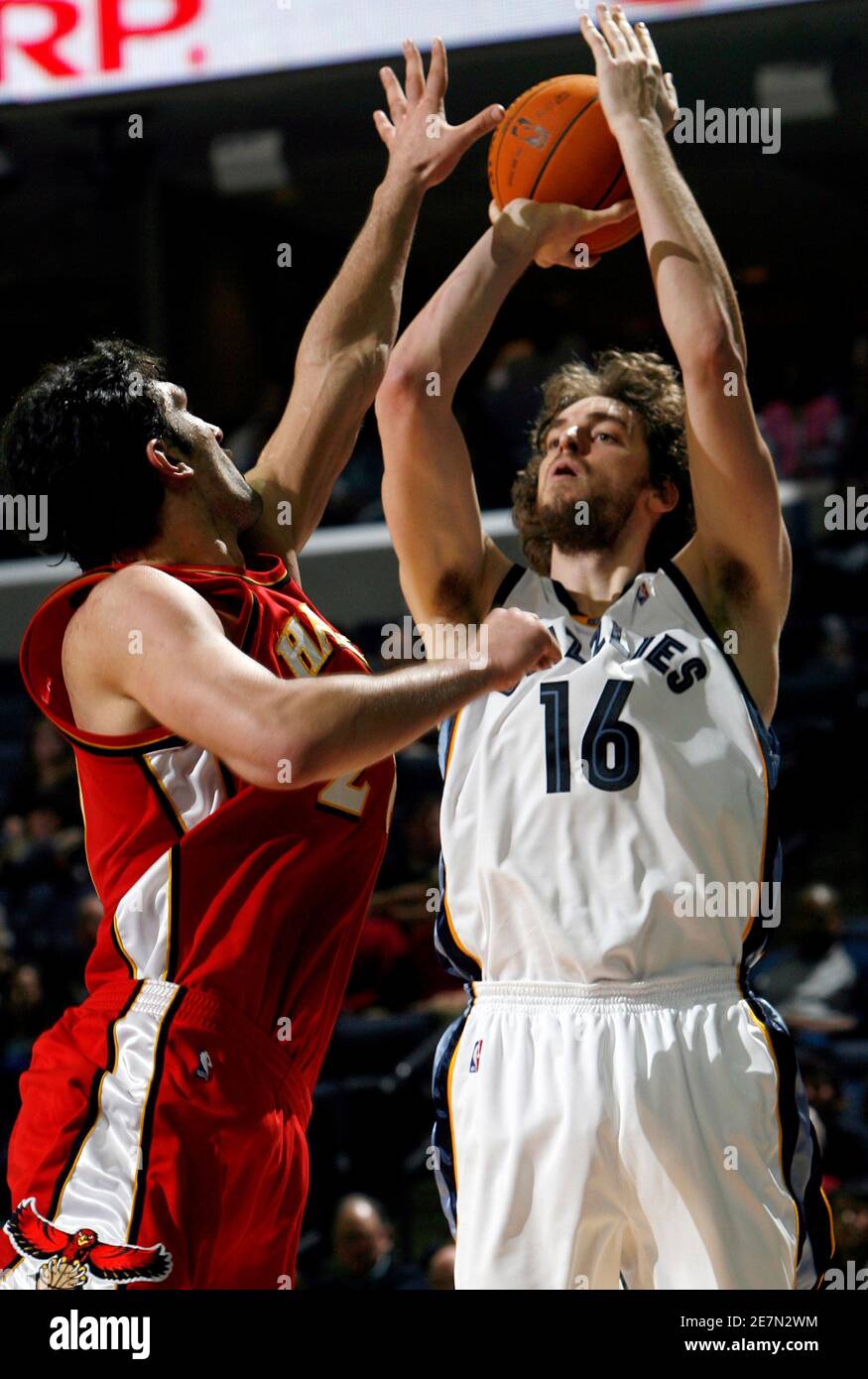 Memphis Grizzlies forward Pau Gasol of Spain (16) shoots as he is defended  by Atlanta Hawks center Zaza Pachulia of Georgia during the fourth quarter  of NBA basketball action in Memphis, Tennessee,