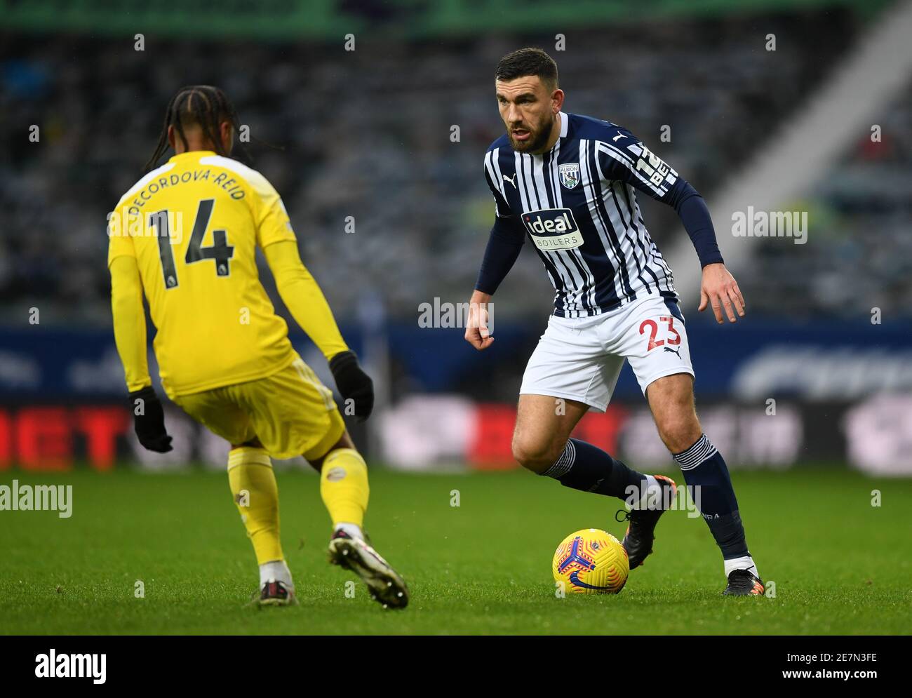 West Bromwich Albion's Robert Snodgrass (right) and Fulham's Bobby Decordova-Reid (left) in action during the Premier League match at The Hawthorns, West Bromwich. Picture date: Saturday January 30, 2021. Stock Photo