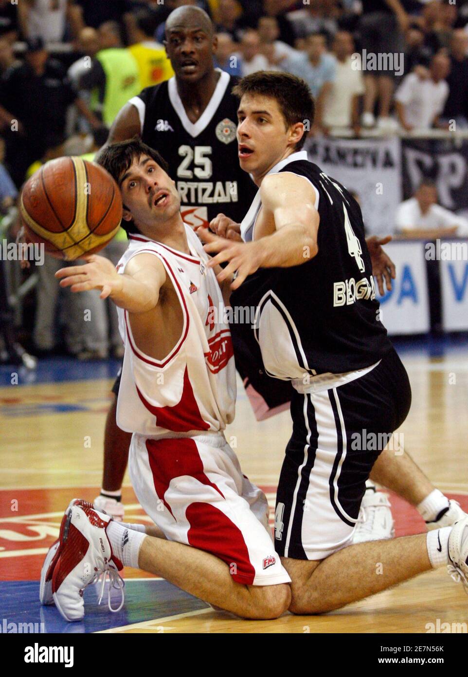 Milos Teodosic (L) of FMP struggles for the ball with Milenko Tepic of Partizan during their Serbian Basketball Championships semi-final match in Belgrade June 8, 2007.  REUTERS/Ivan Milutinovic   (SERBIA) Stock Photo