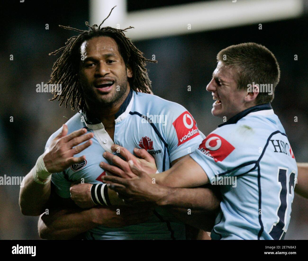 Lote Tuqiri (L) of the Waratahs from Australia is joined by teammate Rob Horne after scoring against the Sharks from South Africa during their Super 14 semi-final rugby match in Sydney May 24, 2008. REUTERS/Will Burgess    (AUSTRALIA) Stock Photo