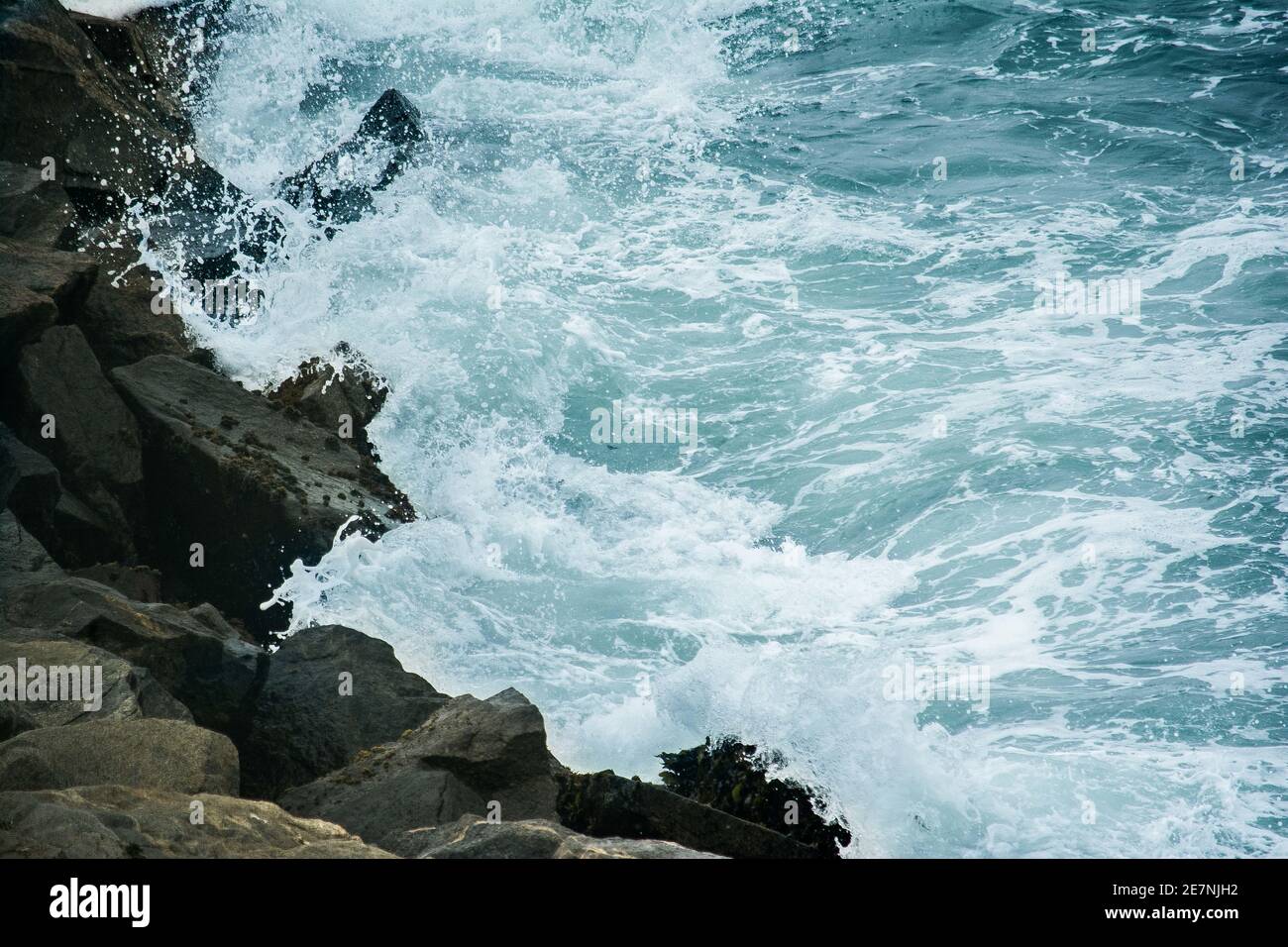 Beautiful shot of a rocky coast with splashing sea waves in San Antonio ...