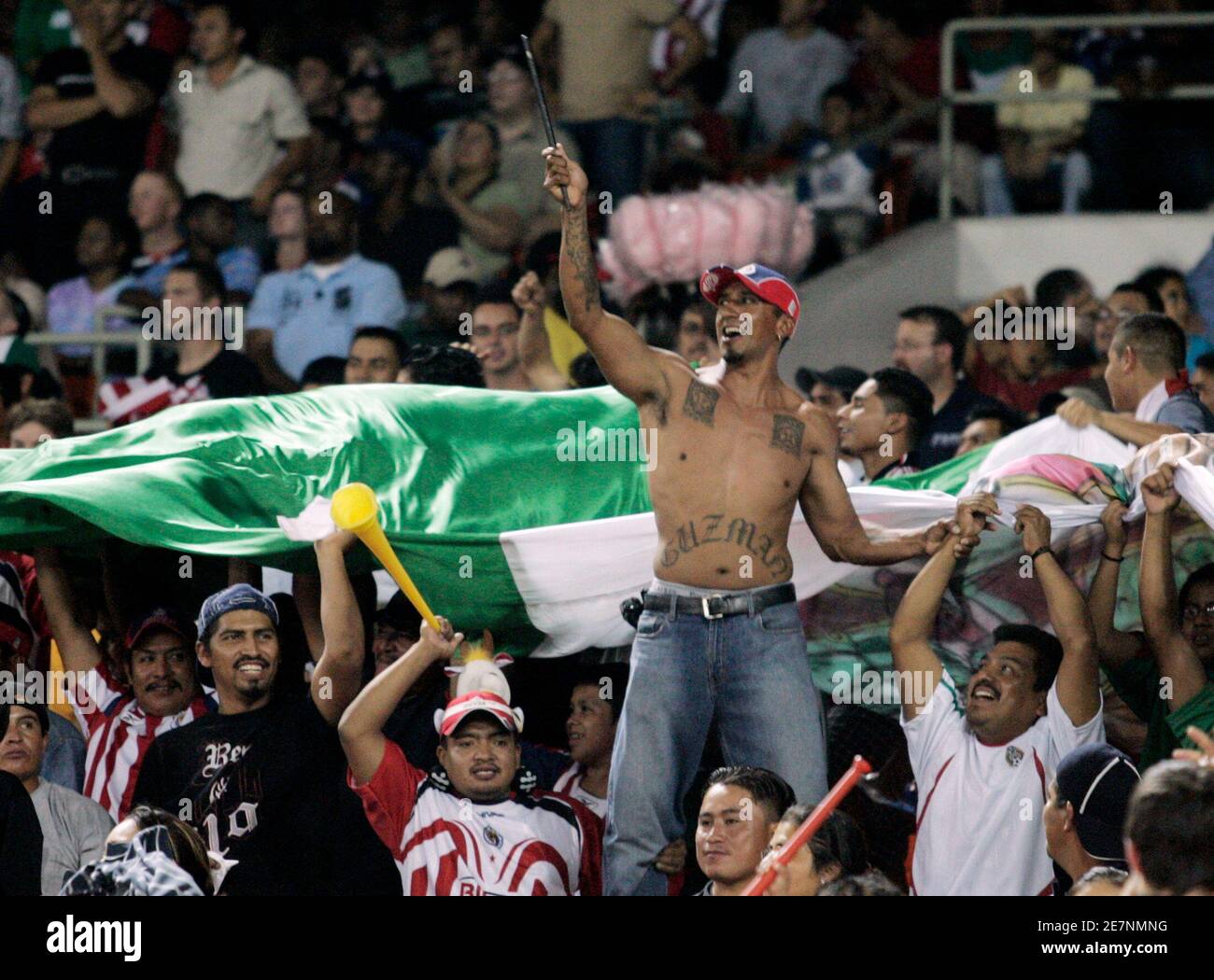 CD Guadalajara fans celebrate their team's first and only goal against D.C. United during their Copa Sudamericana soccer match in Washington, September 26, 2007. REUTERS/Gary Cameron  (UNITED STATES) Stock Photo