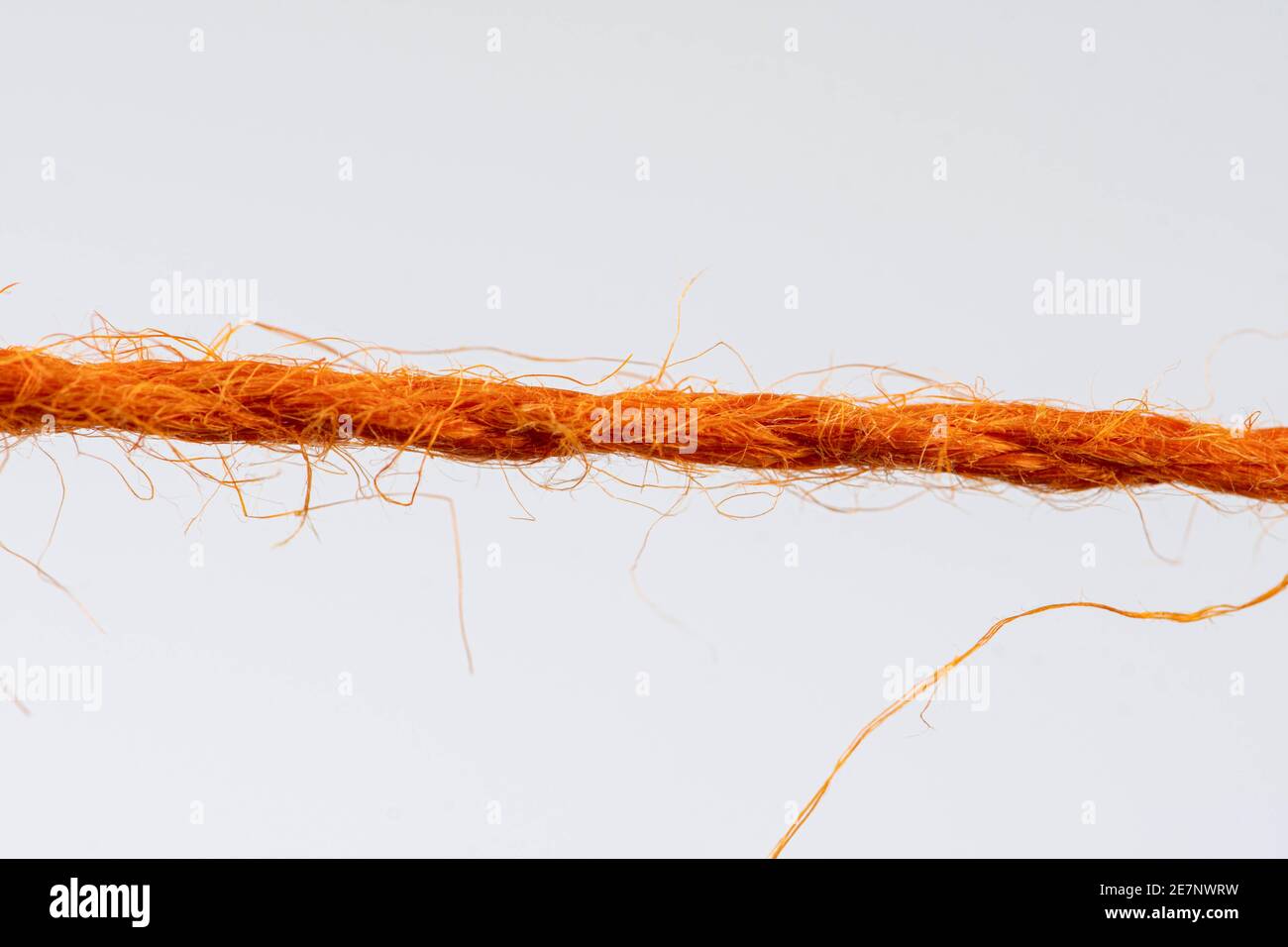 Red Flab Rope red fibrous rope against white background Stock Photo - Alamy
