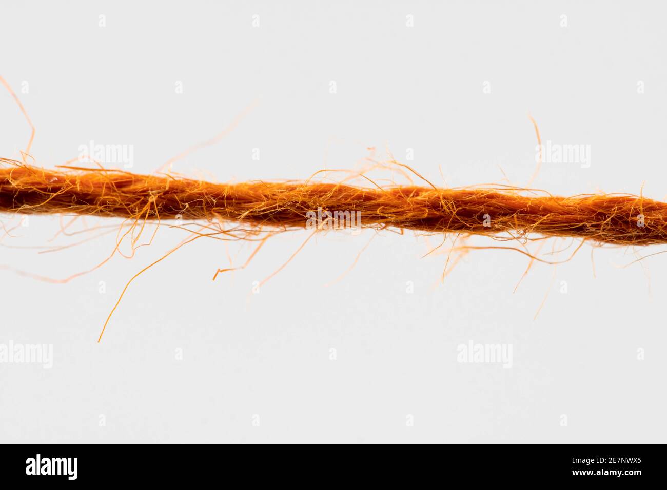 Red Flab Rope red fibrous rope against white background Stock Photo - Alamy
