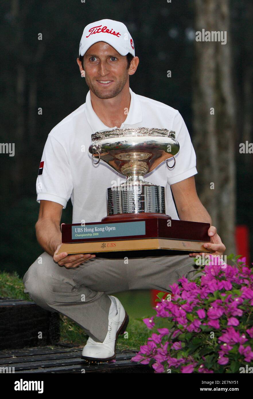 Gregory Bourdy of France holds the trophy after winning the Hong Kong Open golf tournament November 15, 2009.     REUTERS/Tyrone Siu (CHINA SPORT GOLF) Stock Photo