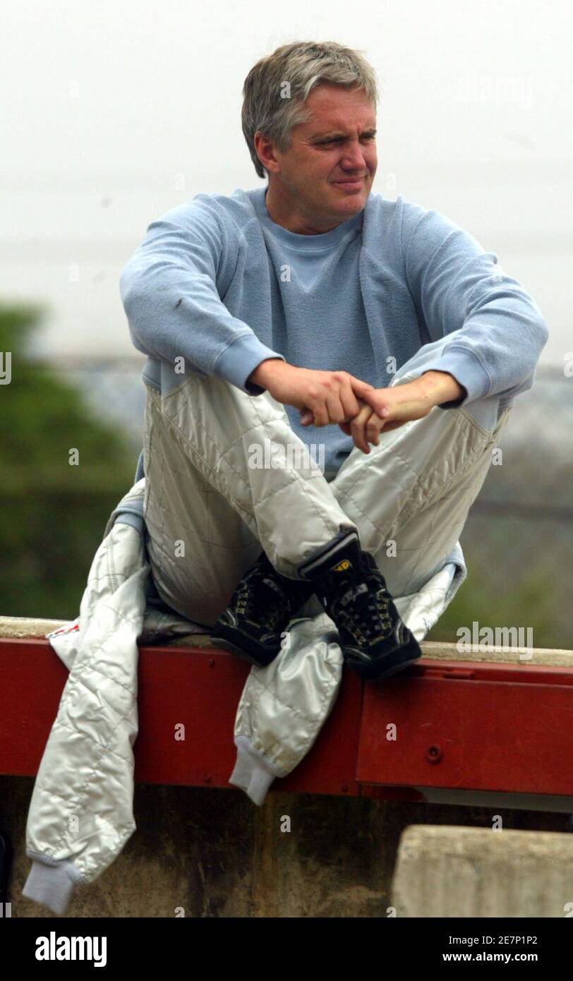 Eddie Cheever of the U.S. relaxes in the pit before riding his Altech car during their free practice session at the Kyalami in Johannesburg November 11, 2005. The Grand Prix race will be held on Sunday. REUTERS Juda Ngwenya Stock Photo