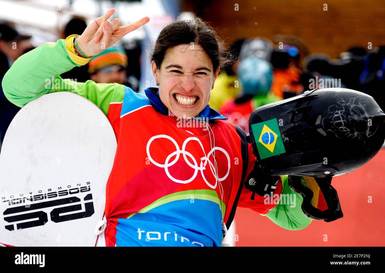 Isabel Clark Ribeiro of Brazil celebrates during the women's snowboard  cross competition at the Torino 2006 Winter Olympic Games in Bardonecchia,  Italy, February 17, 2006. REUTERS/Eric Gaillard Stock Photo - Alamy