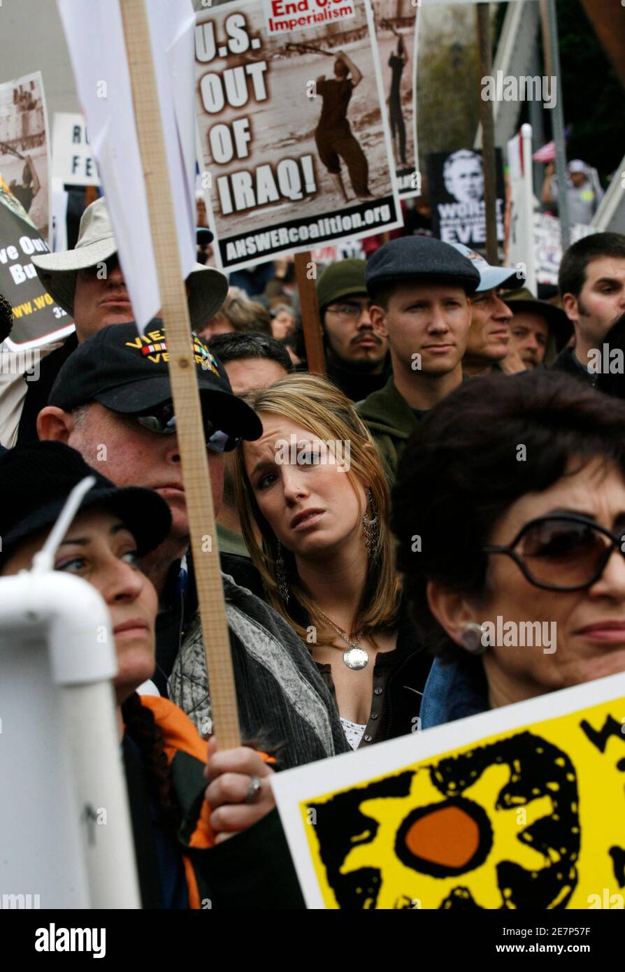 Activists listen to speeches as thousands of protesters prepare to march in Los Angeles January 27, 2007. The march was one of several held around the United States, with protesters demanding that the government bring home U.S. troops in Iraq.  REUTERS/Gus Ruelas (UNITED STATES) Stock Photo