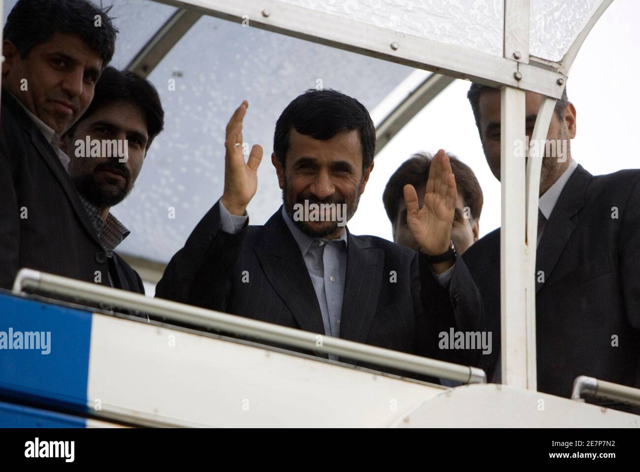 Iran's President Mahmoud Ahmadinejad waves to officials, as he leaves for Saudi Arabia, from Tehran's Mehrabad airport December 17, 2007. Ahmadinejad is heading to the Muslim holy city of Mecca for the annual haj pilgrimage.  REUTERS/Raheb Homavandi (IRAN) Stock Photo