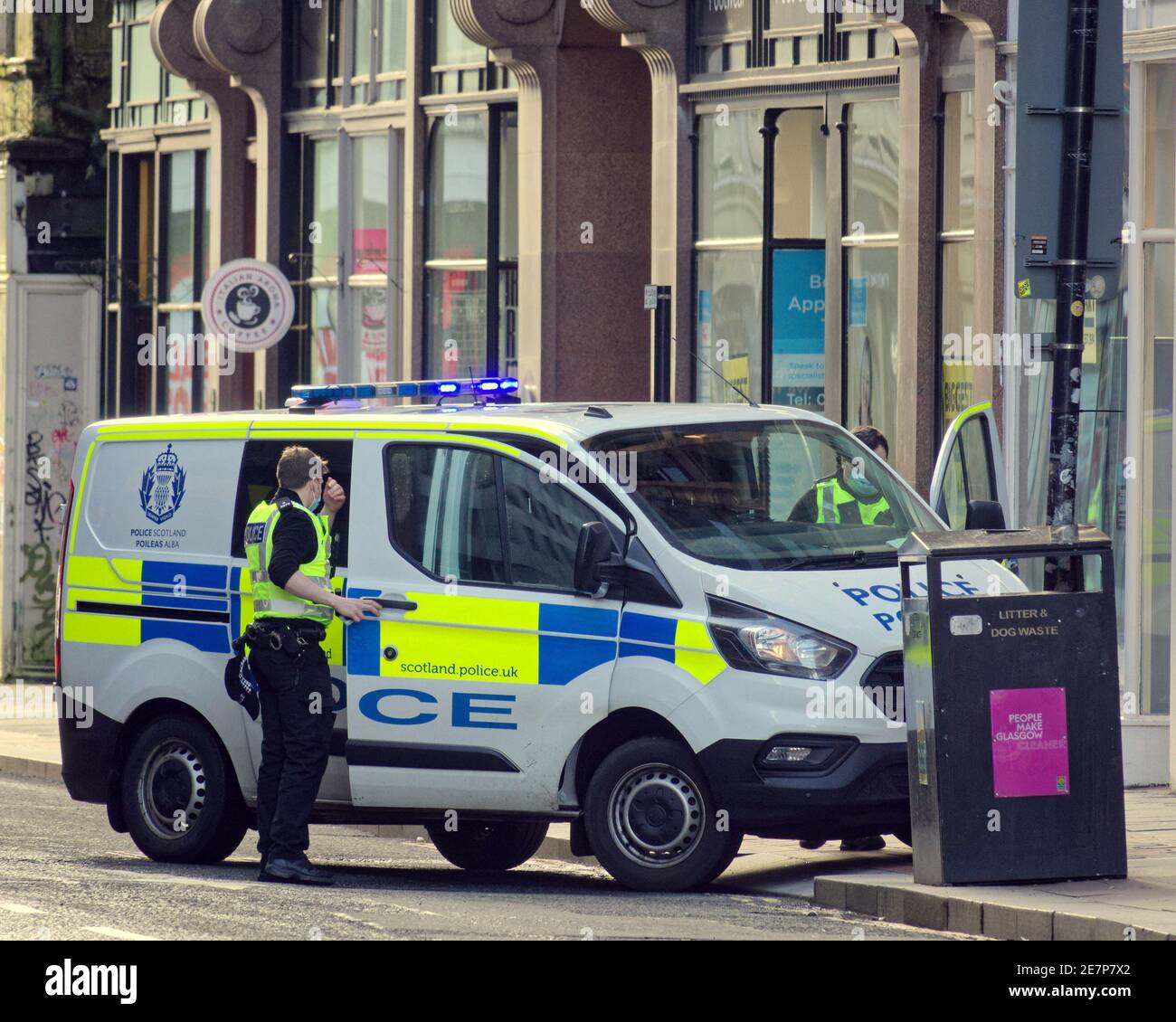 Glasgow, Scotland, UK.30th January, 2021, Lockdown Saturday and police attend an incident behind princes square   Springfield Court breah in on queen streeet  misery continues at least the rain stopped as  deserted streets in the town centre shopping areas relies in posters and wall art as a substitute for life. Credit Gerard Ferry/Alamy Live News Stock Photo