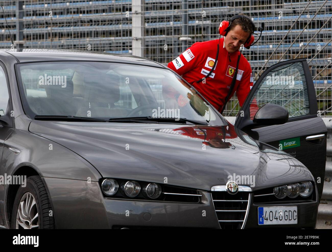 Former Ferrari Formula One driver and world champion Michael Schumacher of  Germany gets into a car during a training session at the Jerez racetrack in  southern Spain March 3, 2009. The F1