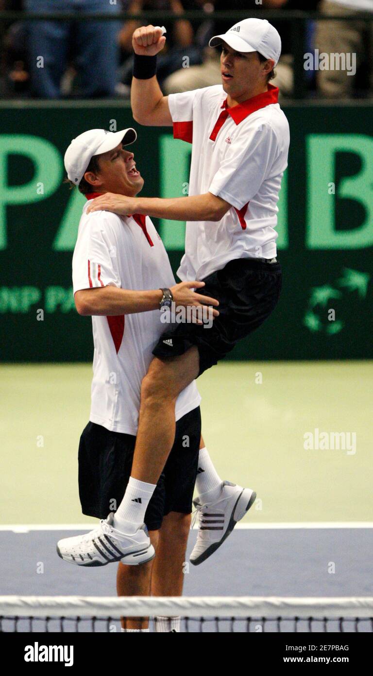 Mike Bryan of the U.S. leaps into the arms of his brother and partner Bob  Bryan upon defeating Yves Allegro and Stanislas Wawrinka of Switzerland in  their Davis Cup doubles tennis match