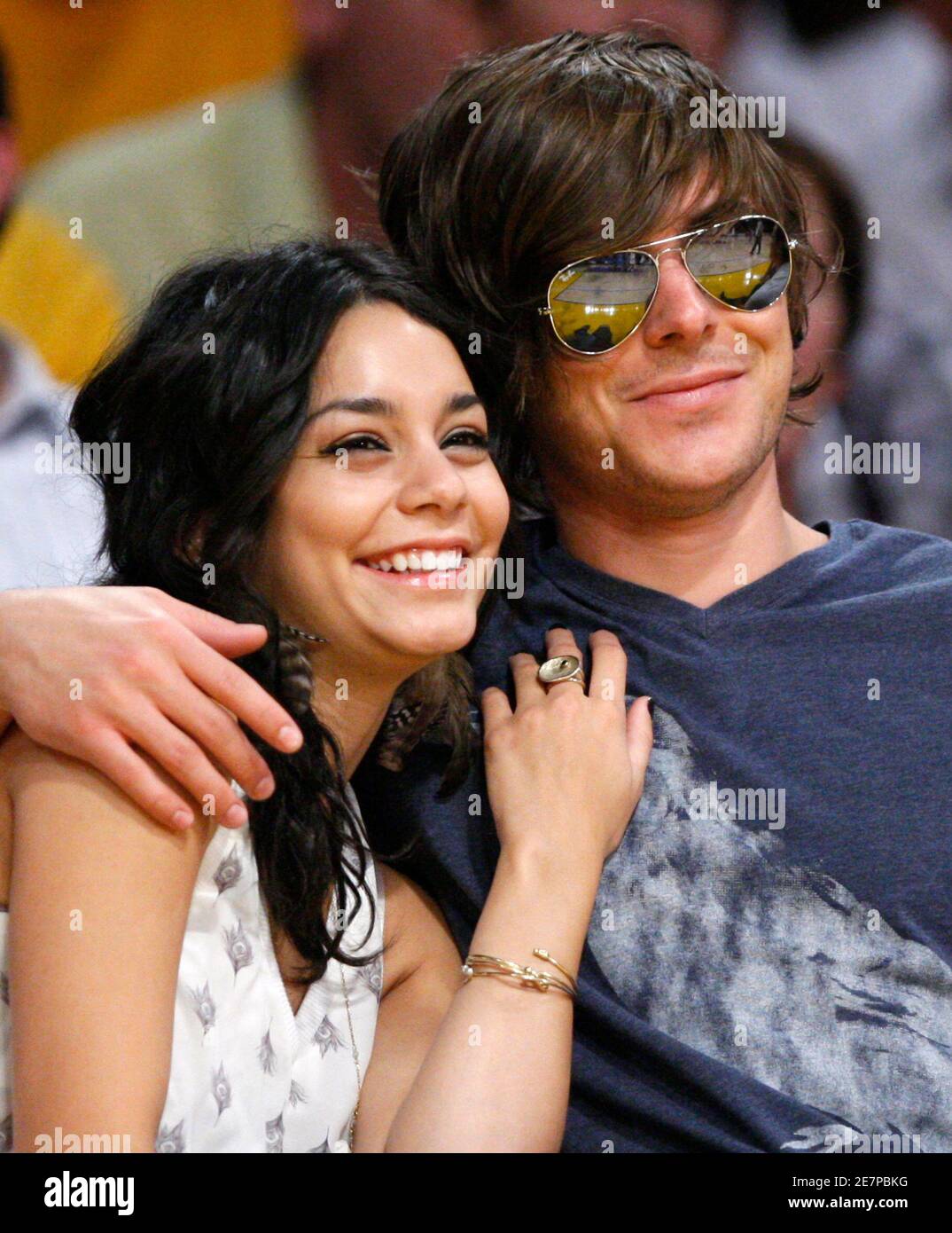 Actors Zac Efron (R) and Vanessa Hudgens watch the Los Angeles Lakers play  the Utah Jazz during the second half of Game 1 of their NBA Western  Conference quarter-final basketball game in