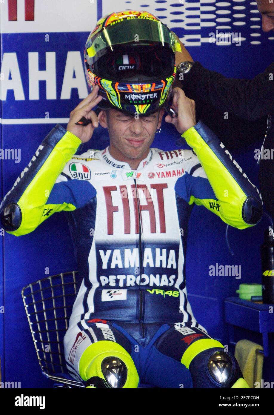 Yamaha MotoGP rider Valentino Rossi of Italy prepares himself for the  second free practice session of the Czech Grand Prix at the Masaryk Circuit  in Brno August 15, 2009. REUTERS/Petr Josek (CZECH