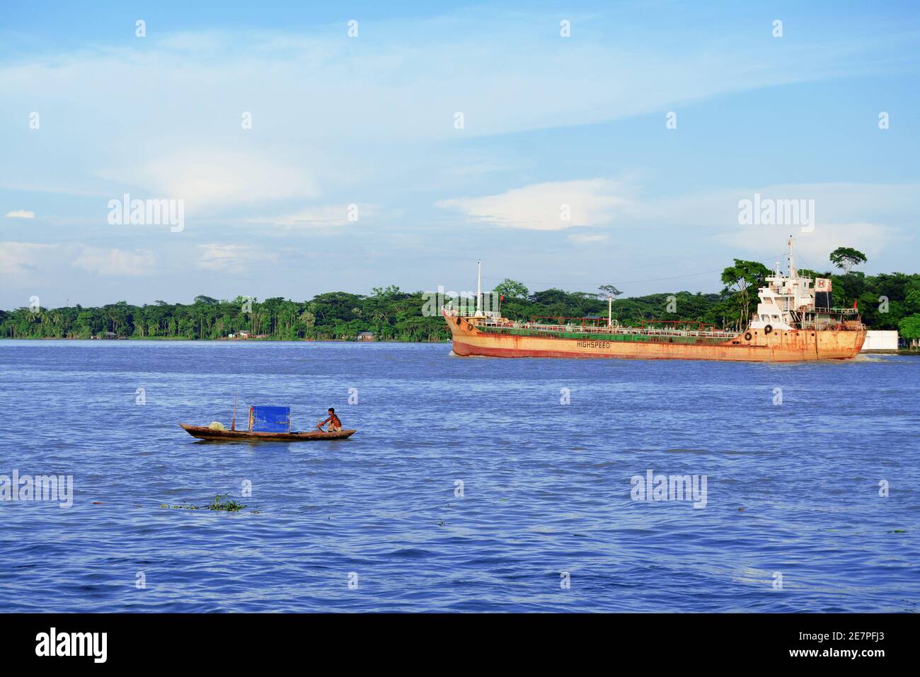 Small boats and cargo ships are going on the Kirtankhola river Stock Photo