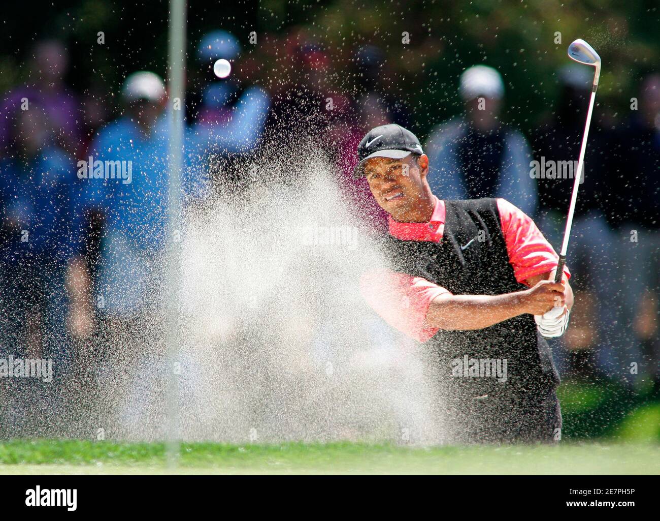 Tiger Woods of the U.S. hits out of a sand trap on the seventh green during the final round at The Players Championship golf tournament in Ponte Vedra Beach, Florida on March 26, 2006. REUTERS/Rick Fowler Stock Photo