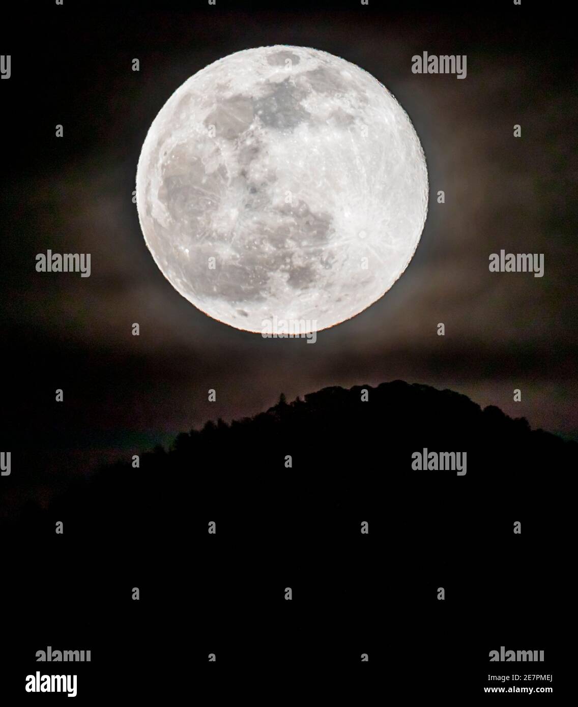 Full Wolf Moon rising over Rocky Mountains, Salida, Colorado, USA Stock Photo