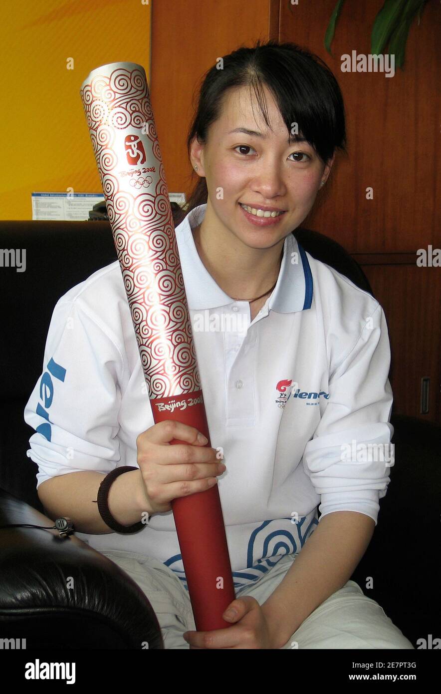 Jin Jing, a 27 year-old amputee and Paralympic fencer, displays a torch for Beijing Olympic Games during an interview with Reuters in Beijing April 11, 2008. The wheelchair-bound Chinese torch bearer has rocketed to national fame after fending off Tibet protesters in Paris, with a torrent of Internet messages feting her as a patriotic symbol of revulsion at the relay mayhem.  REUTERS/Sally Huang (CHINA) Stock Photo