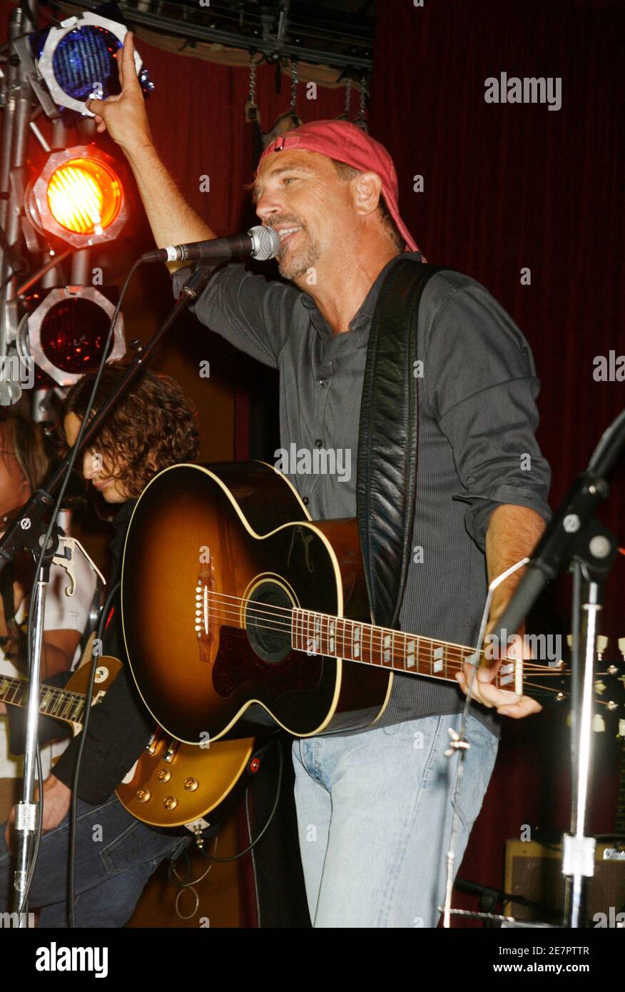Actor Kevin Costner, star of the film 'Swing Vote' plays with his band 'Modern West' at the party following the film's premiere in Hollywood, California  July 24, 2008.  REUTERS/Fred Prouser           (UNITED STATES) Stock Photo