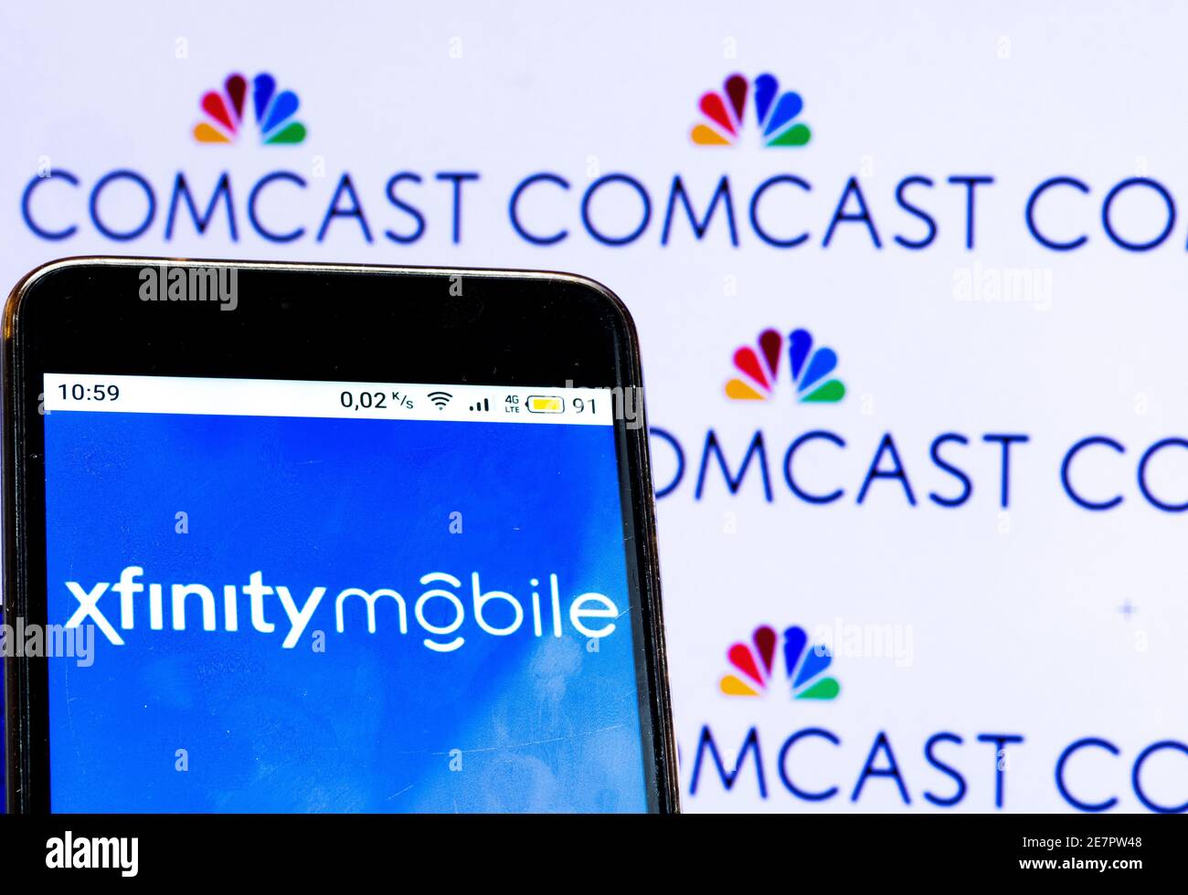 In this photo illustration, an Xfinity mobile logo seen displayed on a smartphone. Stock Photo