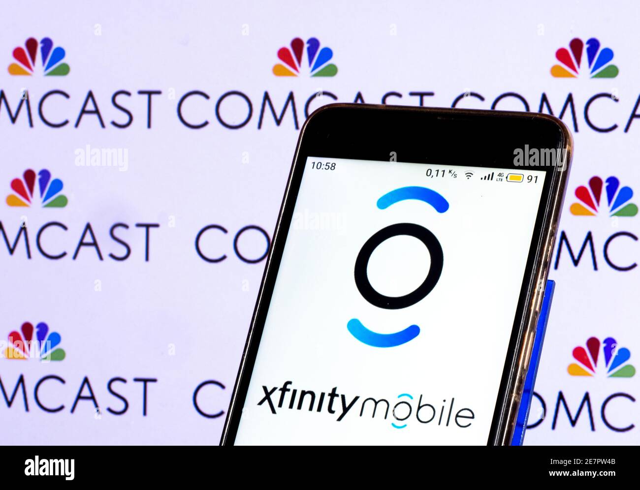In this photo illustration, an Xfinity mobile logo seen displayed on a