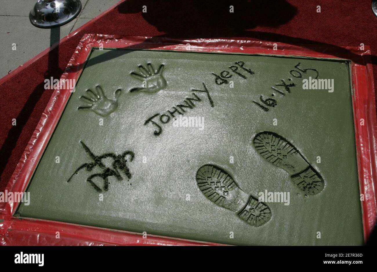 Actor Johnny Depp's signature, handprints and footprints in cement are pictured after ceremonies at the forecourt of Grauman's Chinese Theatre in Hollywood September 16, 2005. Depp's voice is featured in the new animated film 'The Corpse Bride. Stock Photo