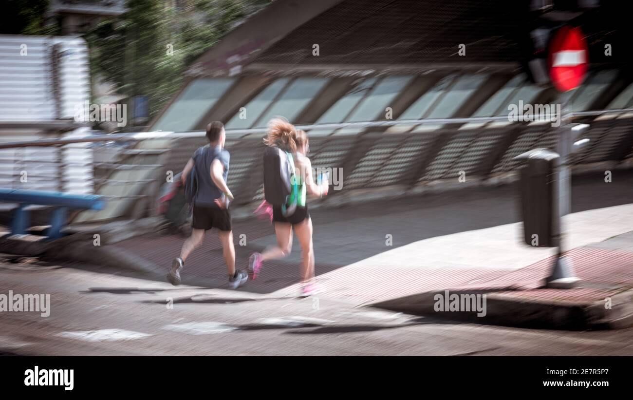 Sweep of two unrecognizable people, running. Stock Photo