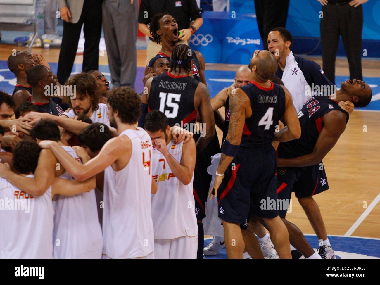 U S Players Celebrate R While The Spanish Team Console Each Other After The Men S Gold Medal Basketball Game At The Beijing 08 Olympic Games August 24 08 The U S Defeated Spain To