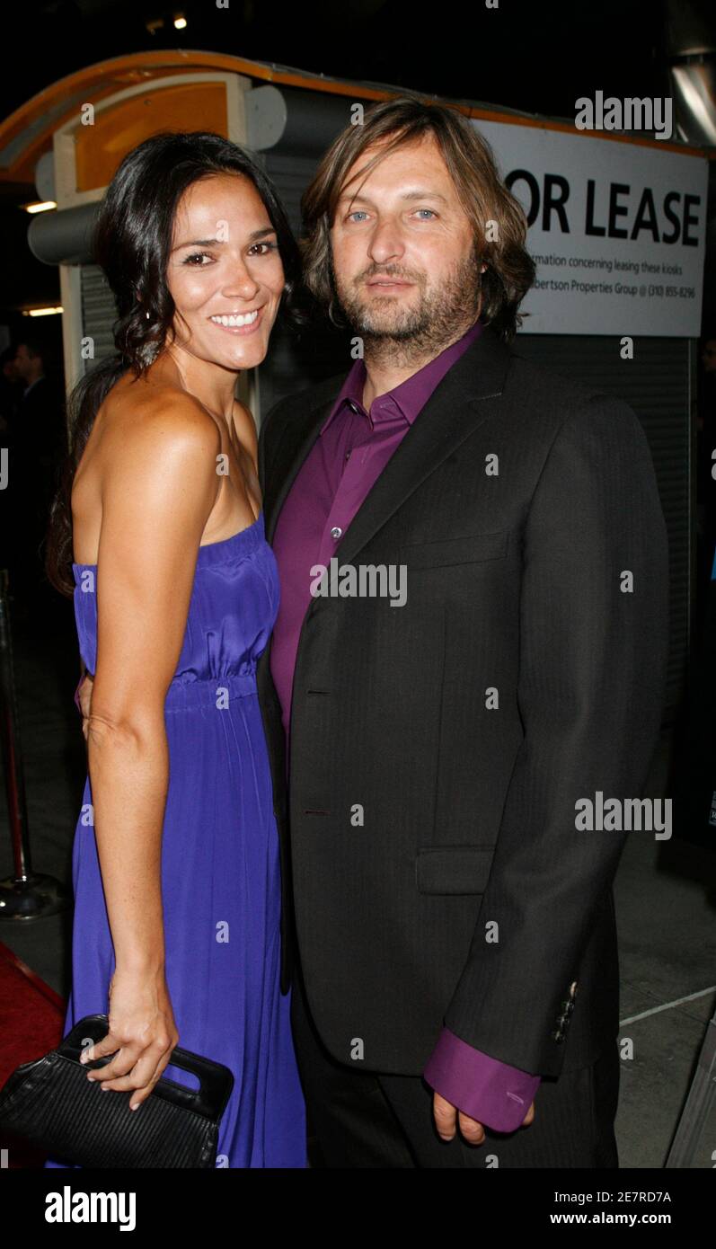 Gregor Jordan, the director of the film 'The Informers' starring Kim Basinger and Mickey Rourke, poses with his wife actress Simone Kessell at the film's premiere in Hollywood, California April 16, 2009. REUTERS/Fred Prouser          (UNITED STATES ENTERTAINMENT) Stock Photo
