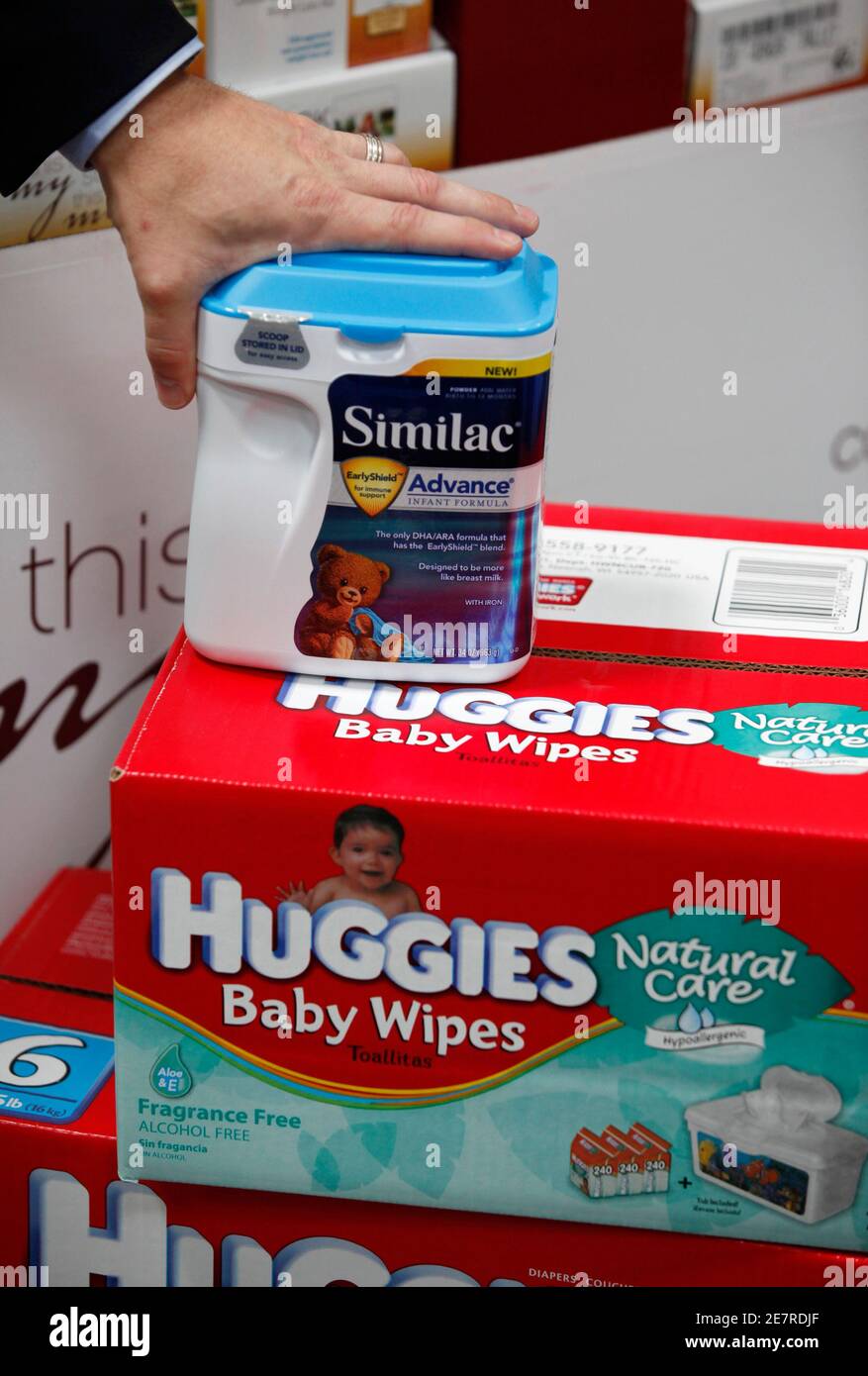 A representative from Sam's Club, a division of Wal-Mart stores, places his  hand on a display of baby products as he speaks to the media inside a Sam's  Club store in Bentonville,