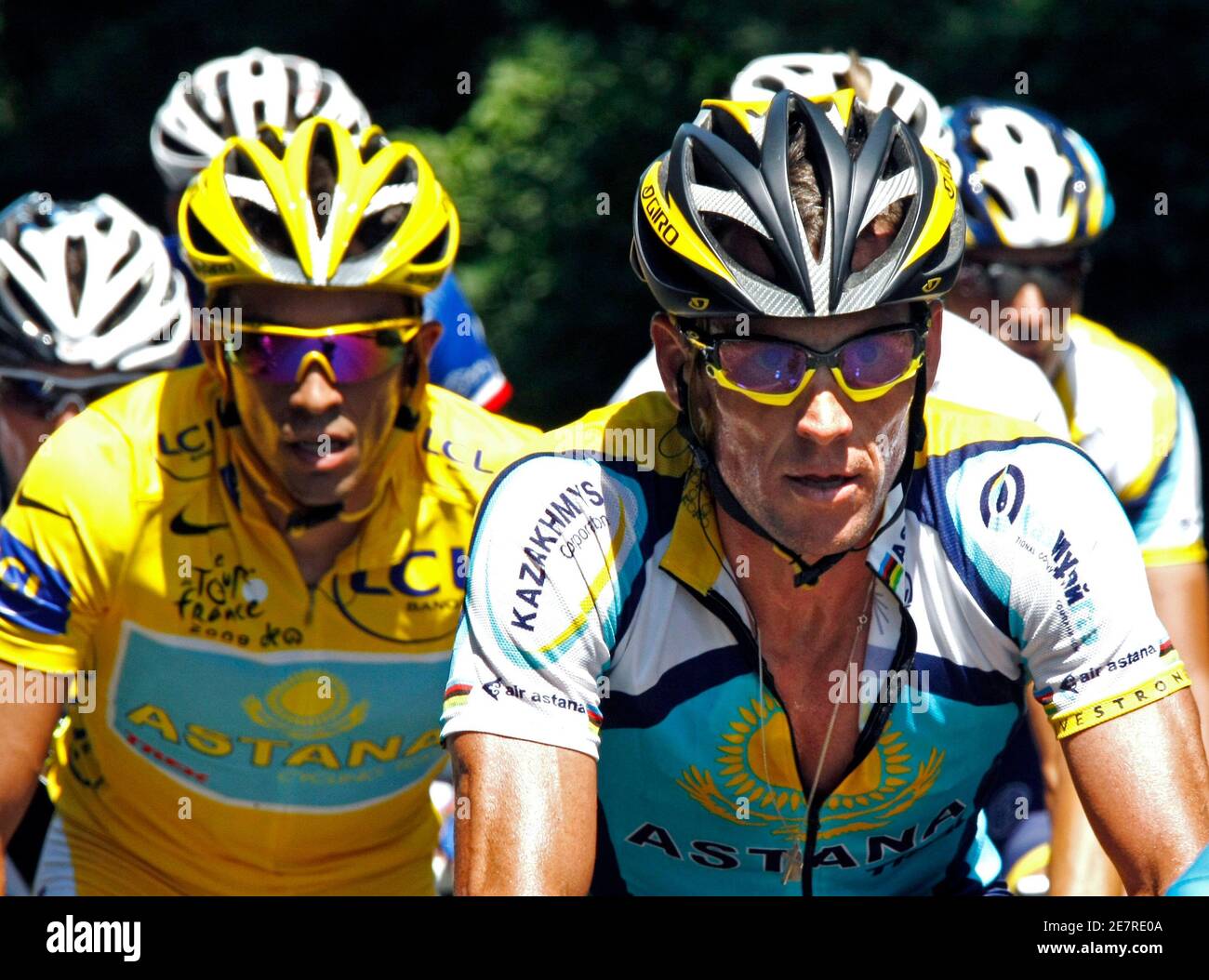 Astana rider and leader's yellow jersey holder Alberto Contador of Spain  (L) cycles with team mate Lance Armstrong of the U.S. (R) during the 19th  stage of the 96th Tour de France