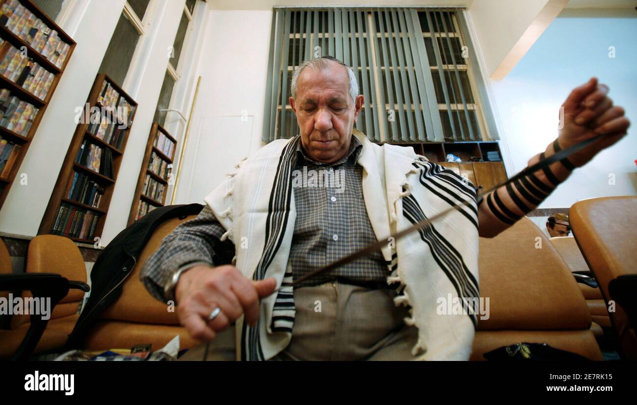An Iranian Jew prepares for prayers at the Yousefabad Synagogue in Tehran November 23, 2006. Iran is home to about 25,000 Jews, the largest Jewish population in the Middle East outside Israel. The creation of the state of Israel and Iran?s Islamic Revolution led to increased Jewish emigration from Iran.   REUTERS/Raheb Homavandi (IRAN) Stock Photo