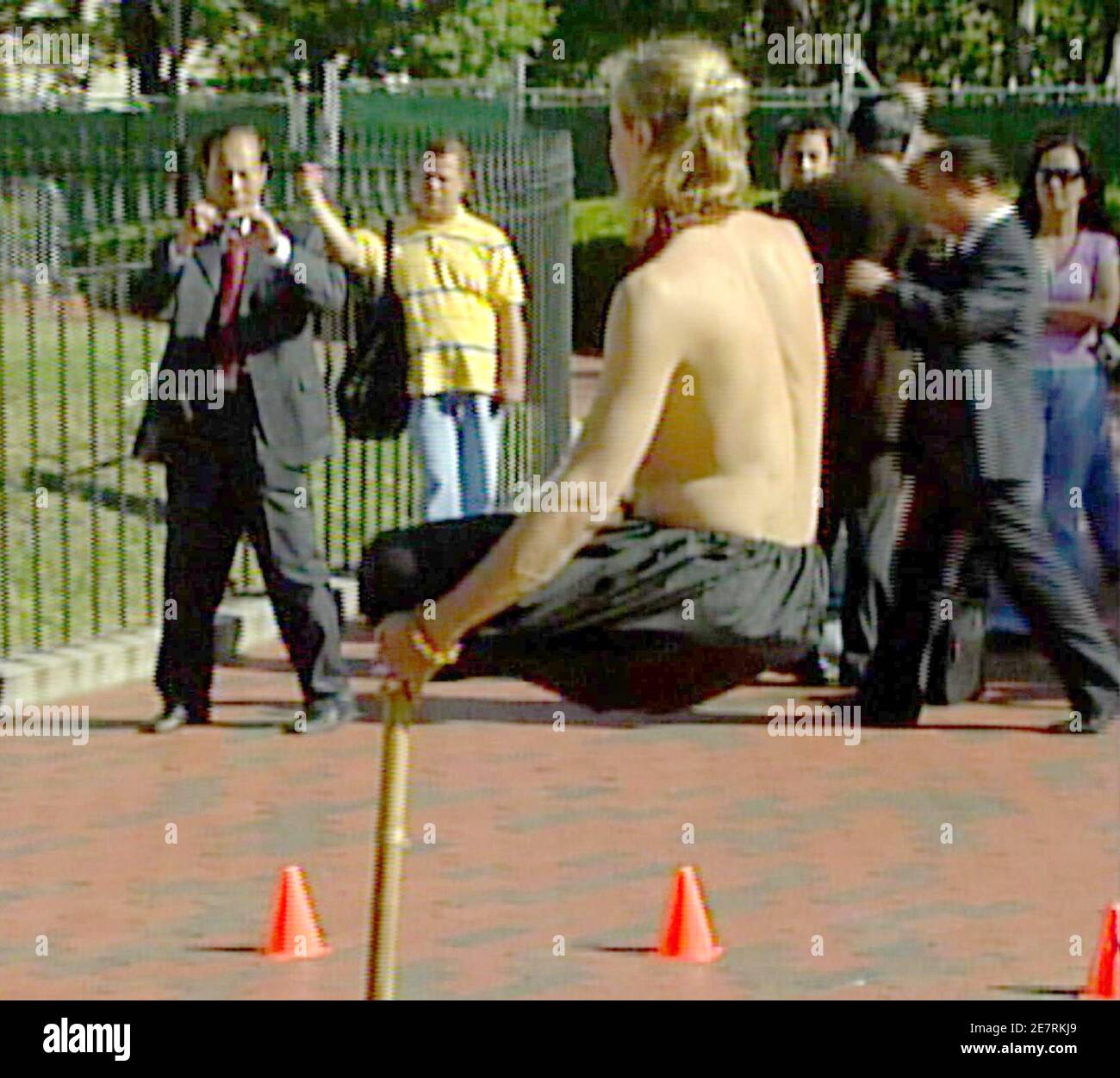 Magician Ramana of the Netherlands performs his 'open air levitation' at Lafayette Park in front of the White House in this image taken from TV footage October 22, 2007. Ramana, who was trained in Indian Magic, is touring various cities in the U.S.   REUTERS/Reuters TV  (UNITED STATES) Stock Photo