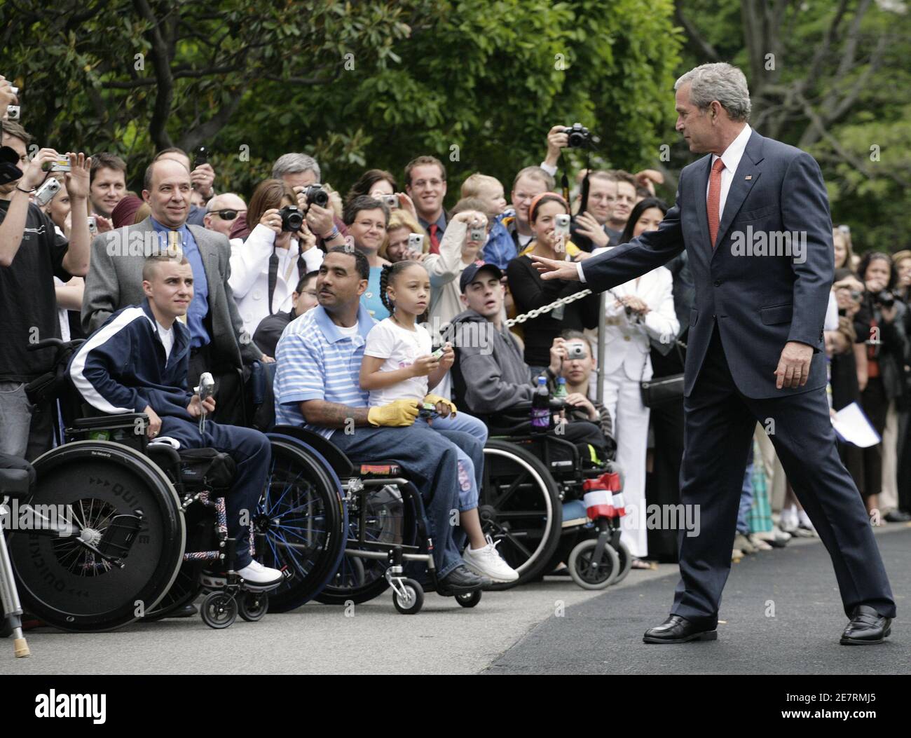 U.S. President George W. Bush (R) greets soldiers wounded in Iraq who are warded at Walter Reed Medical center on the South Lawn of the White House in Washington before his departure May 18, 2007. Bush is going to attend a Republican Party in Richmond, Virginia and spend weekend at his ranch in Crawford, Texas. REUTERS/Yuri Gripas (UNITED STATES) Stock Photo