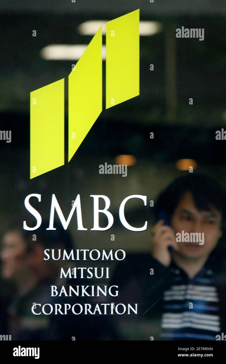A Man Leaves A Branch Of Sumitomo Mitsui Banking Corporation In Tokyo May 16 08 Reuters Kiyoshi Ota Japan Stock Photo Alamy