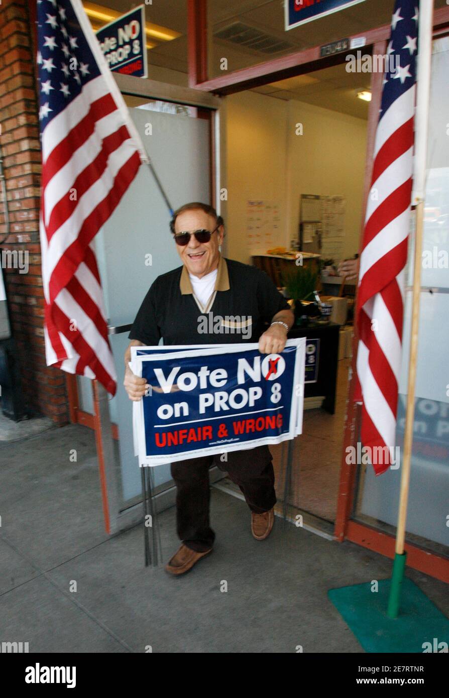 A man who refused to give his name carries a yard sign from the No on 8 proposition headquarters in West Hollywood, California October 29, 2008. Voters in California will be asked on November 4, 2008 to amend their state constitution to recognize marriage as only between a man and a woman, a bid to override a court ruling allowing same-sex unions. Similar proposals will be on the ballot in the battleground states of Arizona and Florida.   REUTERS/Fred Prouser      (UNITED STATES) Stock Photo