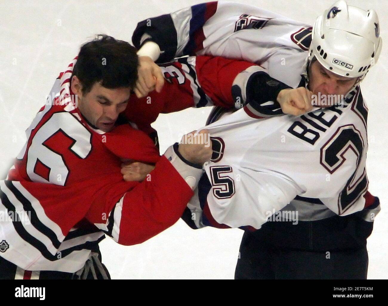 vancouver-canucks-defenseman-kevin-bieksa-r-and-chicago-blackhawks-forward-matthew-barnaby-fight-moments-after-the-start-of-their-game-in-chicago-january-5-2006-reutersfrank-polich-2E7T5KM.jpg