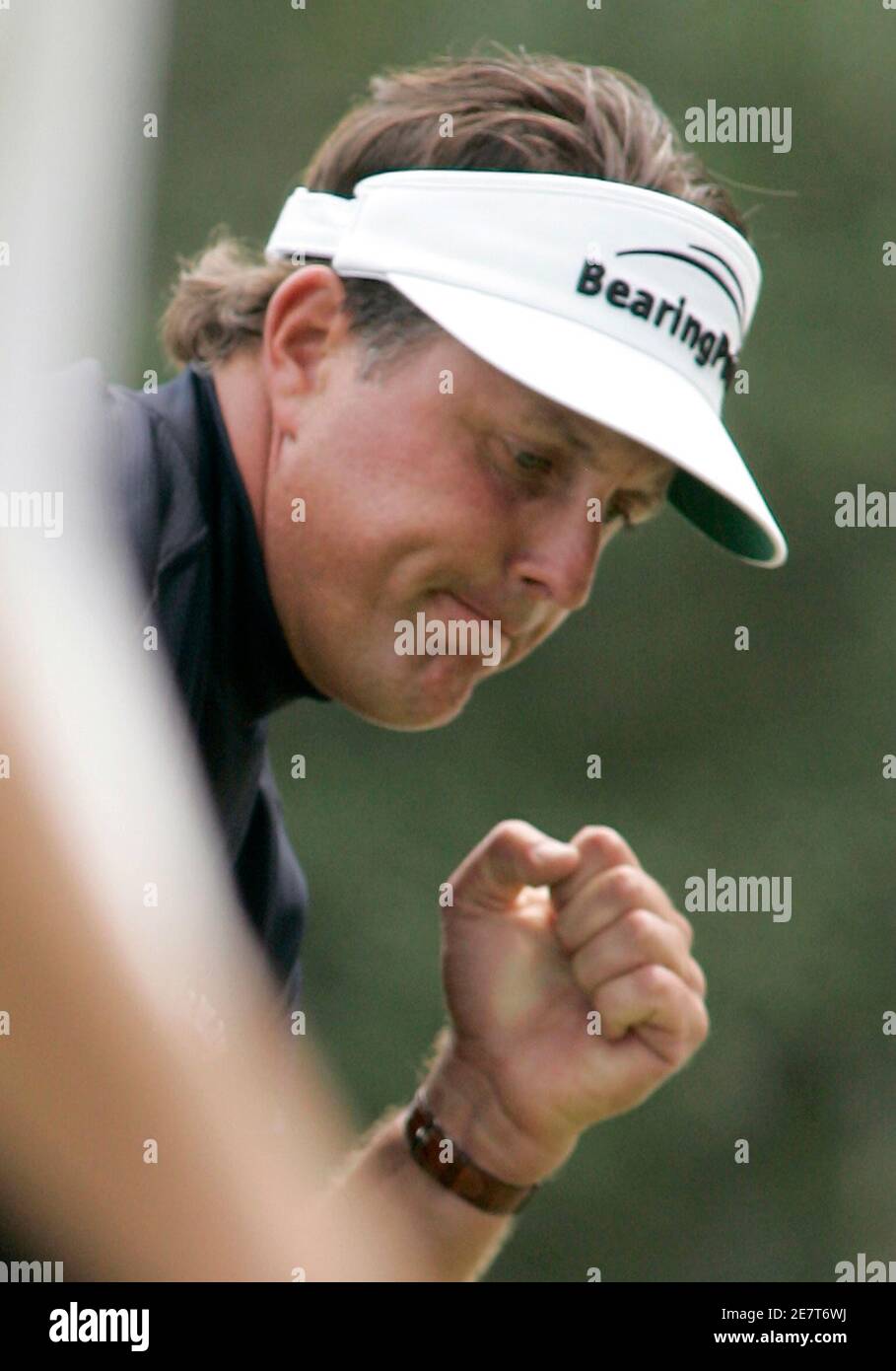 Phil Mickelson reacts after making a birdie putt on the first hole during the final round of play at The Players Championship golf tournament in Ponte Vedra Beach, Florida May 13, 2007. REUTERS/Rick Fowler (UNITED STATES) Stock Photo