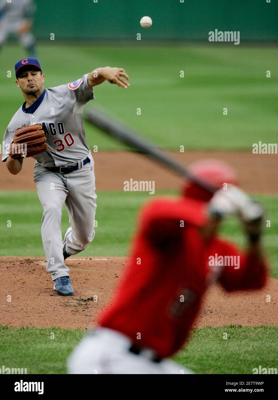 Chicago Cubs starting pitcher Ted Lilly (L) throws against Washington Nationals batter Cristian Guzman (R) in the first inning of their baseball game in Washington April 27, 2008.     REUTERS/Gary Cameron   (UNITED STATES) Stock Photo