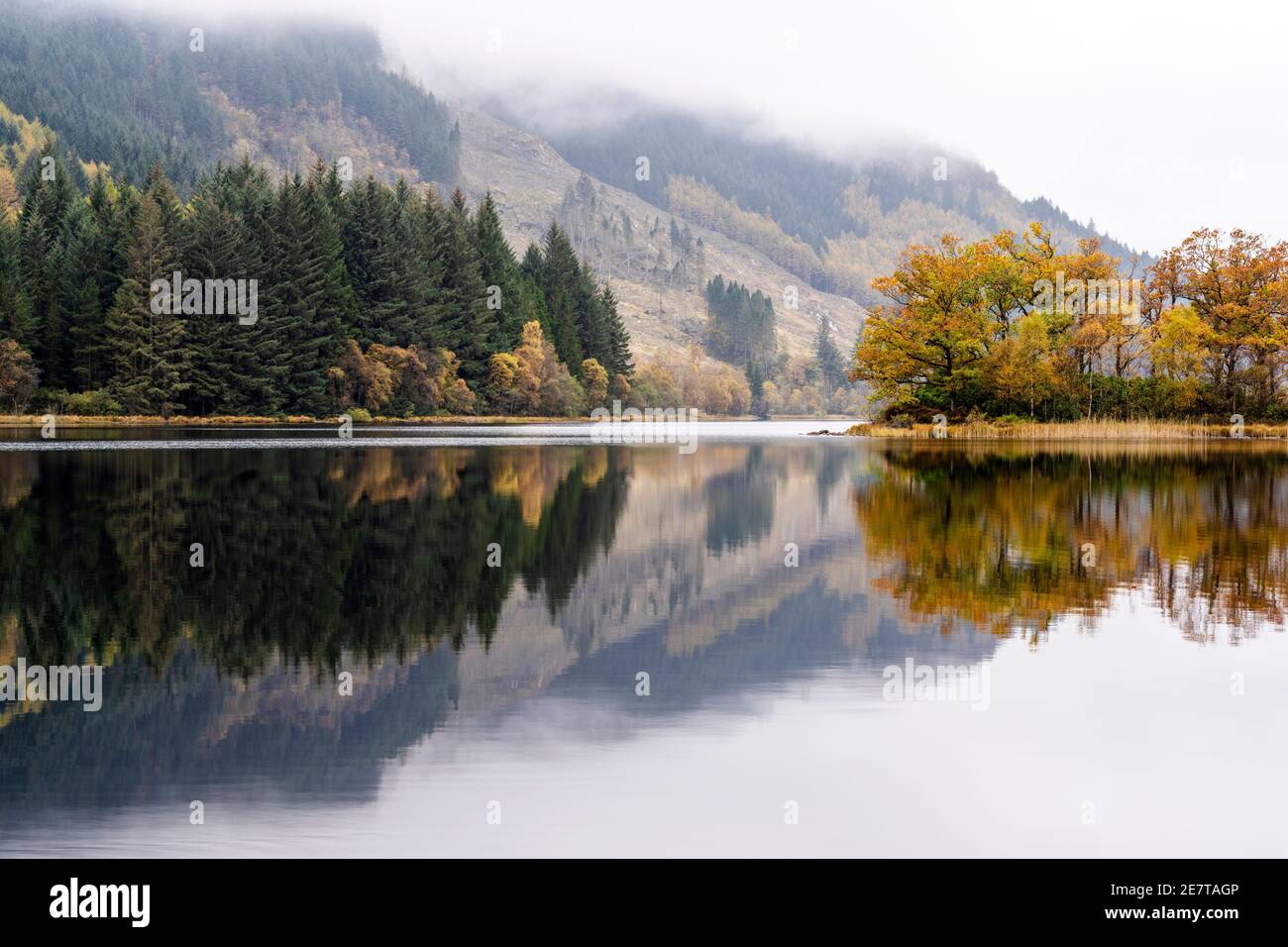 Autumn reflections on Loch Chon in the Trossachs, Scotland, UK Stock Photo