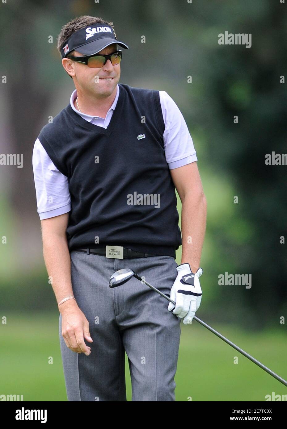 Golfer Robert Allenby of Australia reacts to his shot on the eleventh fairway during the third round of the Northern Trust Open golf tournament in the Pacific Palisades area of Los Angeles February 21, 2009. REUTERS/Gus Ruelas (UNITED STATES) Stock Photo