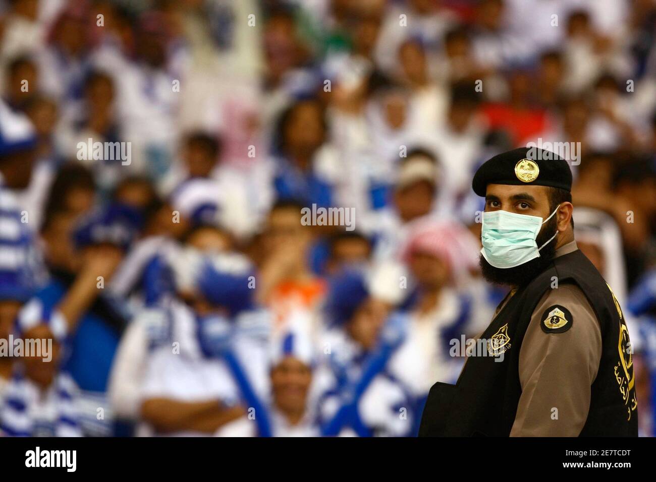 A security guard keep watch during the Saudi league championship soccer match between Al Hilal and Al Itihad  in Riyadh April 12, 2009.    REUTERS/Fahad Shadeed (SAUDI ARABIA SPORT SOCCER) Stock Photo